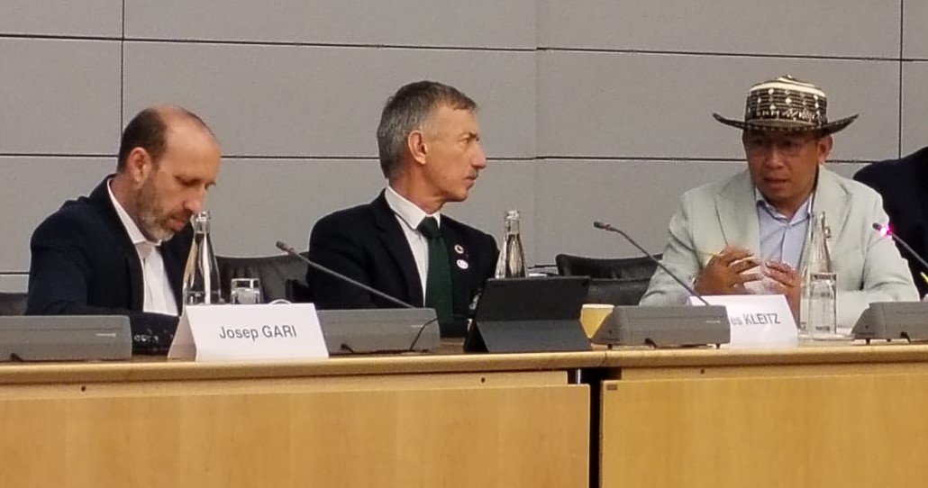 Josep Garí (UNDP), Gilles Kleitz (AFD/France) and Dario Mejía (UNPFII) during the special panel on indigenous peoples & global finance, held at the OECD headquarters, Paris, 22 June 2023. cover image
